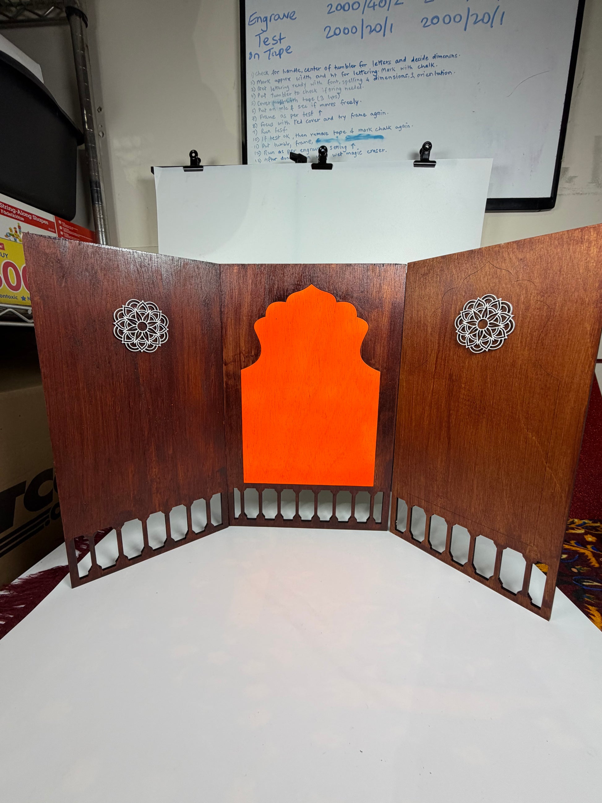     Handcrafted wooden Ganesh Mandap with Ganesha idol in traditional home temple arrangement.