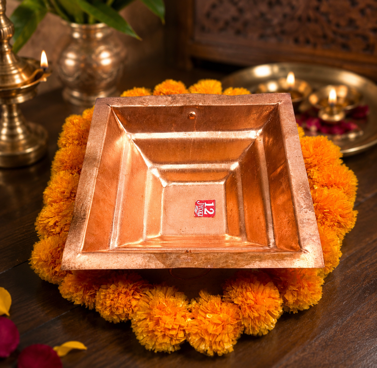Copper Havan Kund for Hindu Puja and Yagna Ceremony, Traditional Square Copper Fire Pit Bowl Decorated with Orange Marigold Flowers on Wooden Table, Sacred Vedic Ritual Accessories