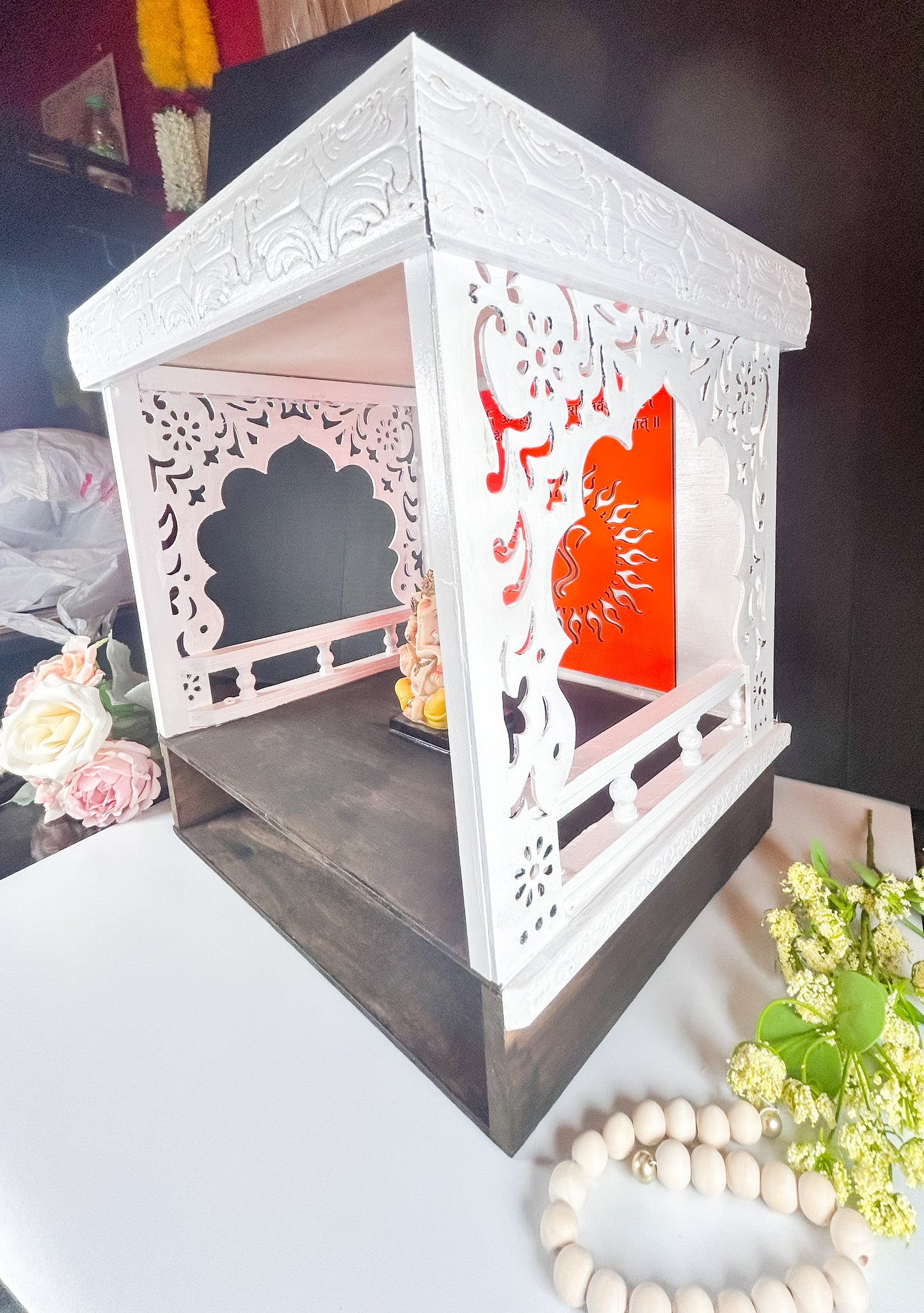     Elegant wooden Pooja Mandir for home prayer room, featuring handcrafted details and a compact tabletop design.