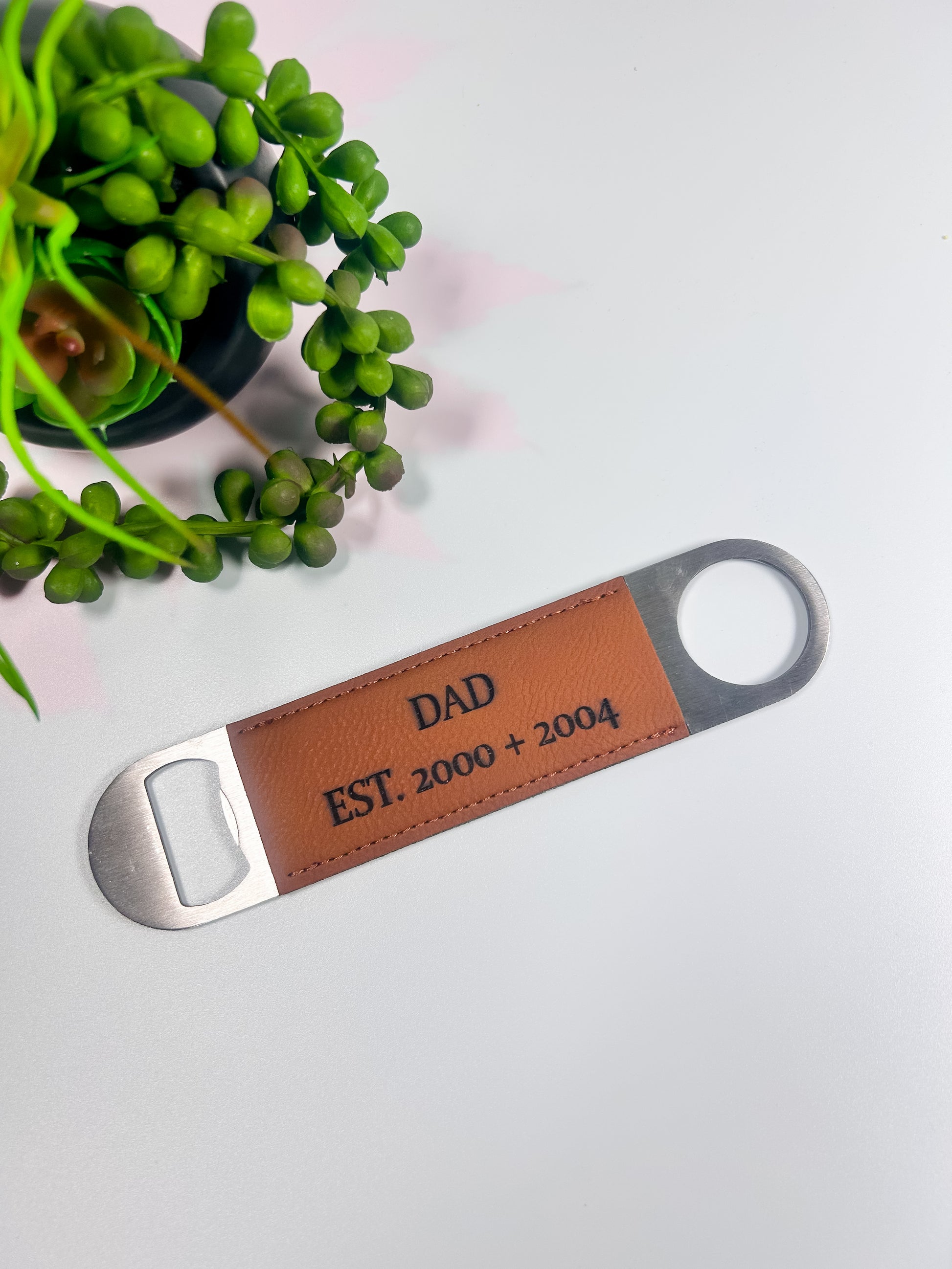 Personalized wooden handle bottle opener engraved with custom name and stainless steel opener.