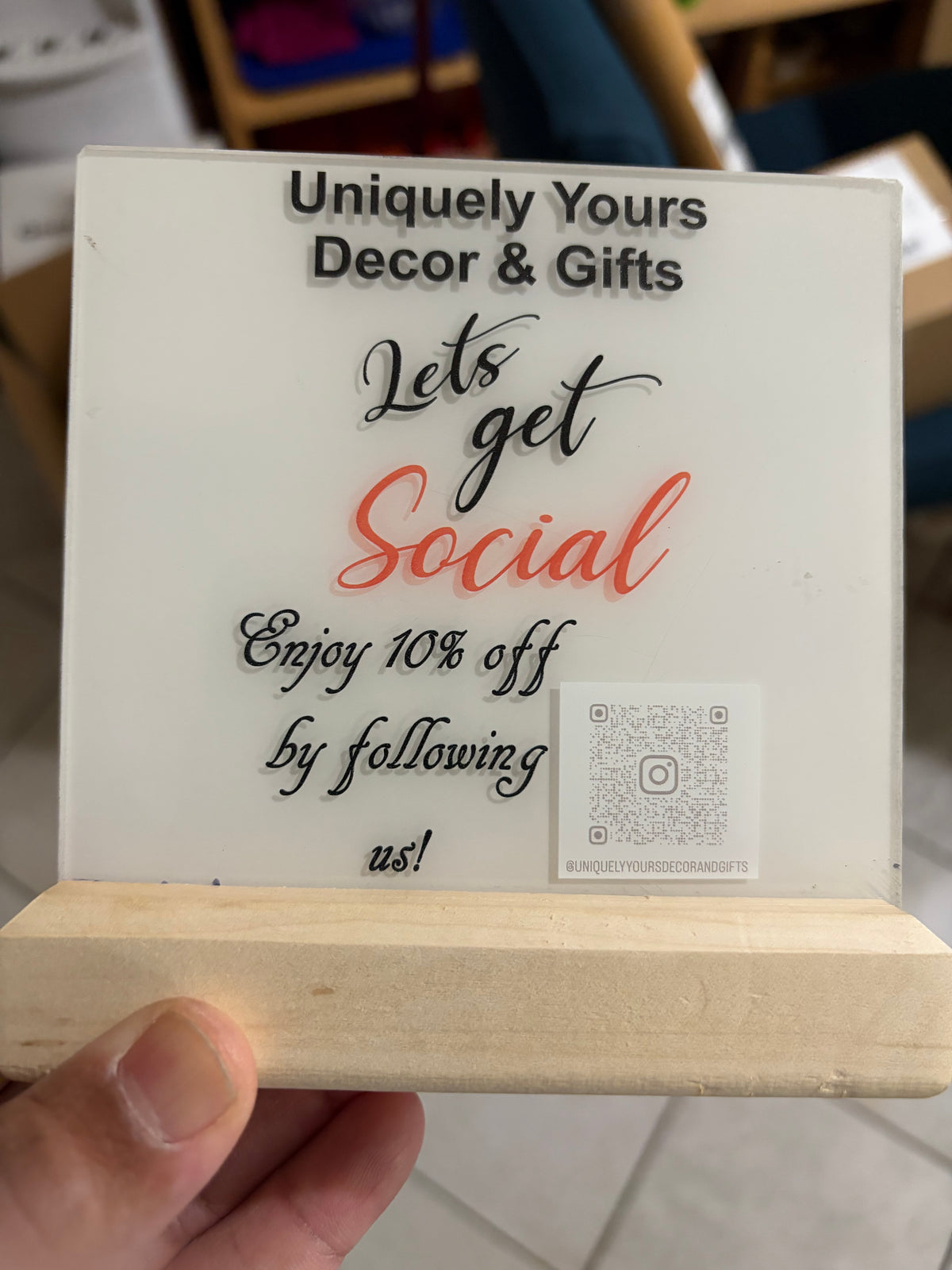 Uniquely Yours Decor and Gifts booth sign featuring personalized gifts, home décor, laser engraving, and UV printing services.
