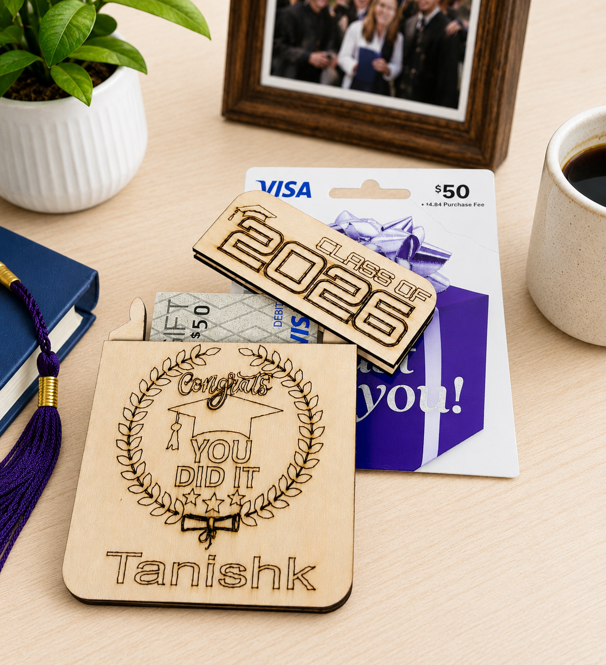 Personalized wooden graduation gift card holder engraved with graduate name and Class of 2026 design holding a gift card and cash.